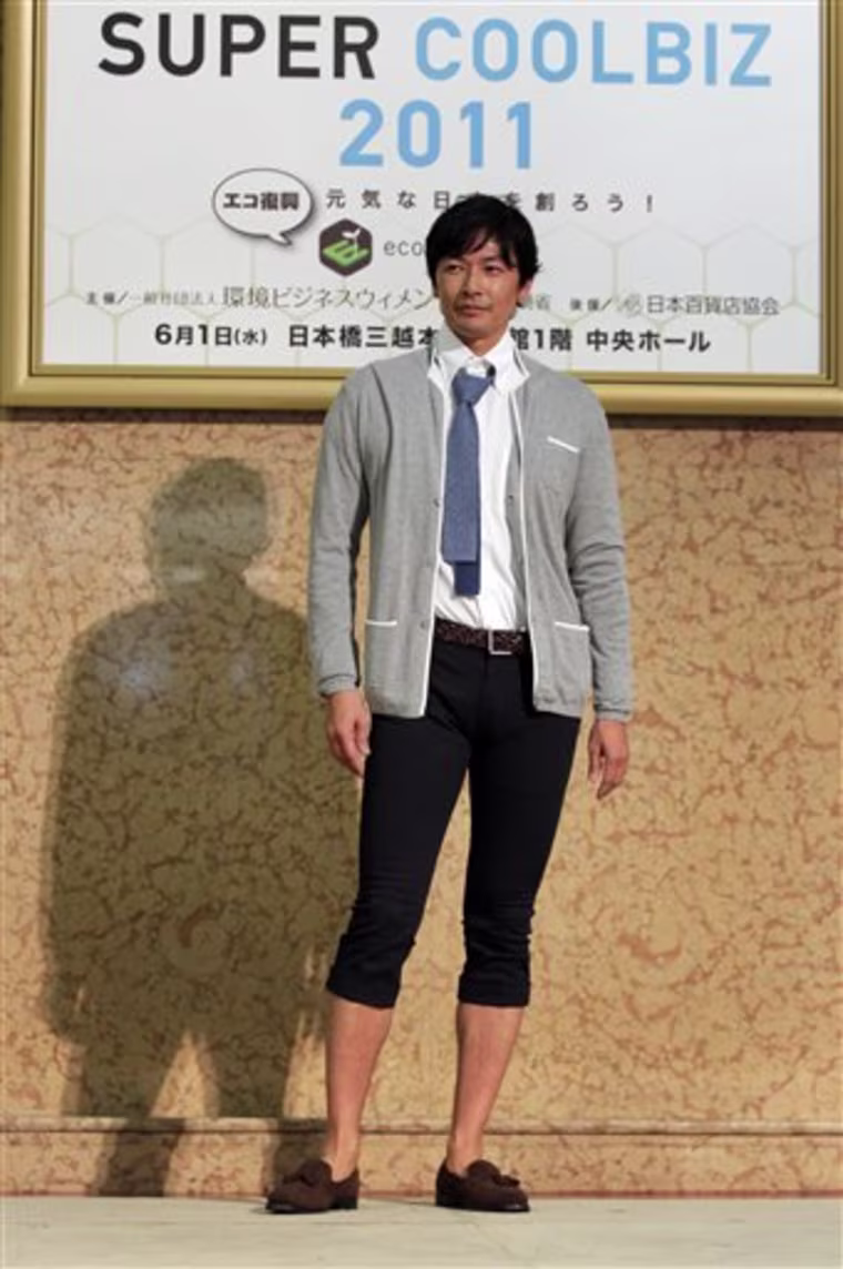 A model presents a casual office wear during a \"Super Cool Biz\" fashion show Wednesday, June 1, 2011. Japan's \"Super Cool Biz\" campaign kicked off with the government-sponsored event featuring outfits appropriate for the office yet cool enough to endure the sweltering heat. This summer may be especially brutal. Looming for Japan is a potential power crunch, the result of the March 11 tsunami crippling the Fukushima Dai-ichi nuclear power plant. (AP Photo/Itsuo Inouye)